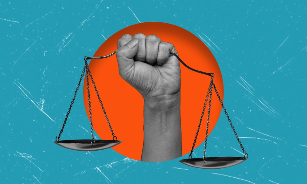 Image of a clenched fist and the scales of Justice.