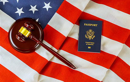 Denaturalization Resources - U.S. passport and gavel on American flag